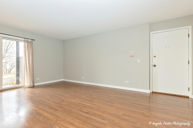 spare room with light wood-type flooring