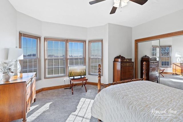 carpeted bedroom with ceiling fan and a closet