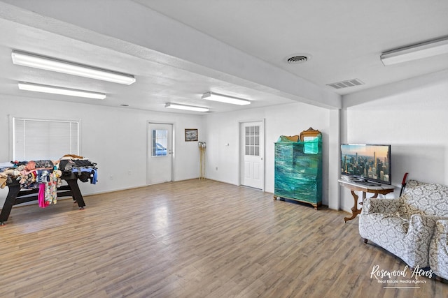 sitting room featuring hardwood / wood-style floors