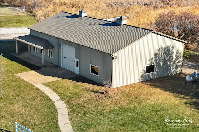 view of home's exterior featuring a lawn and a patio area