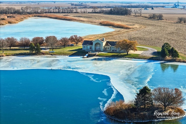 birds eye view of property with a rural view and a water view