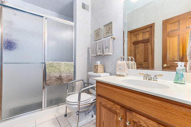 bathroom with tile patterned flooring, vanity, toilet, and an enclosed shower