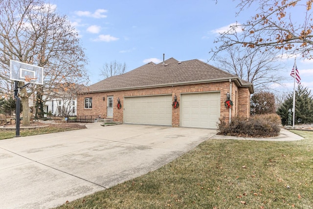 view of side of property featuring a garage and a lawn