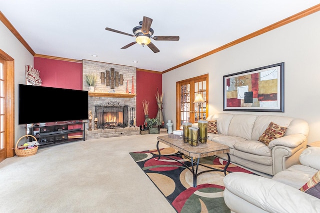 carpeted living room with crown molding, a fireplace, and ceiling fan