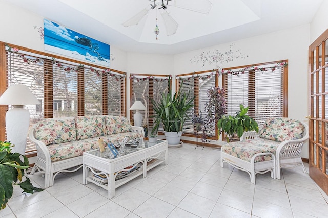 living room featuring light tile patterned floors and ceiling fan