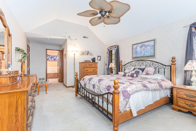 carpeted bedroom with ceiling fan, lofted ceiling, and connected bathroom