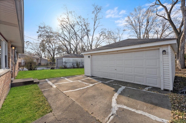 garage featuring a yard