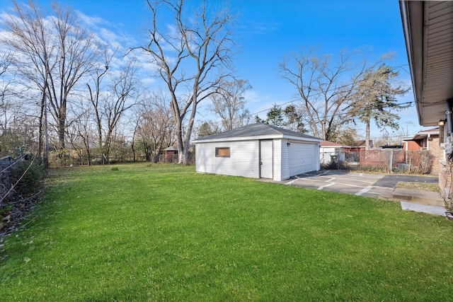 view of yard with an outbuilding and a garage