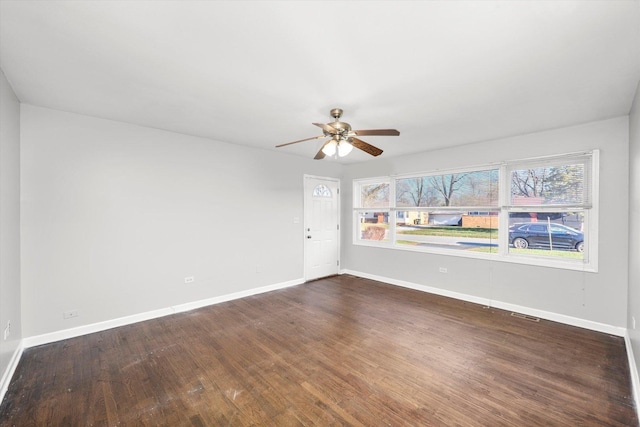 unfurnished room featuring dark hardwood / wood-style flooring