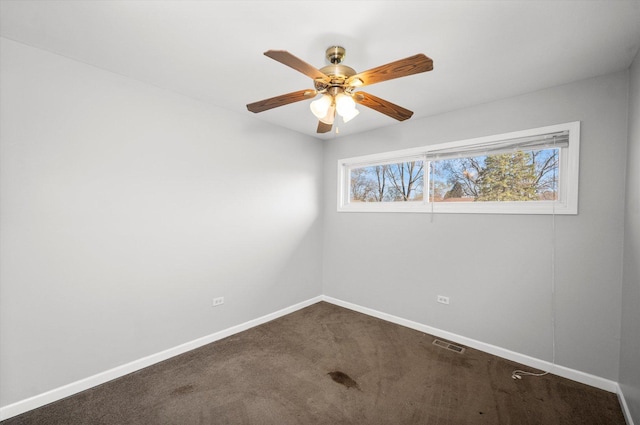 unfurnished room with ceiling fan and carpet floors