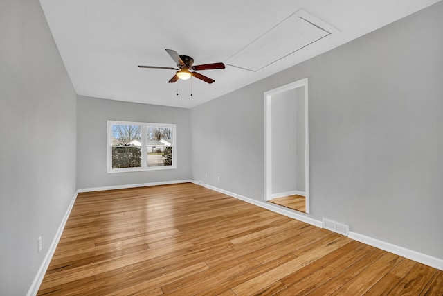 spare room with light hardwood / wood-style floors and ceiling fan