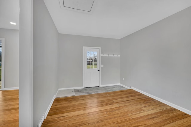 foyer entrance with light hardwood / wood-style floors