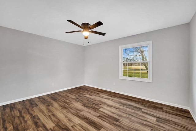 empty room with hardwood / wood-style floors and ceiling fan