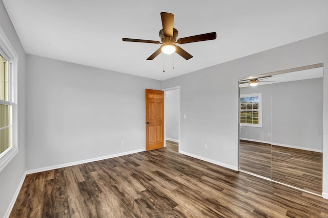 empty room with dark hardwood / wood-style floors