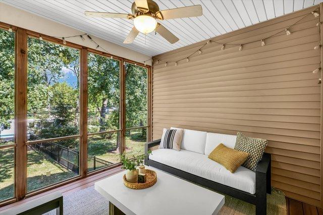 unfurnished sunroom with ceiling fan and wood ceiling