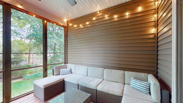 sunroom with ceiling fan and wood ceiling