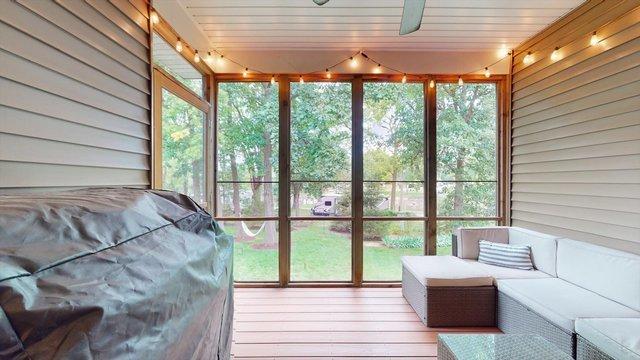 sunroom featuring plenty of natural light and wood ceiling