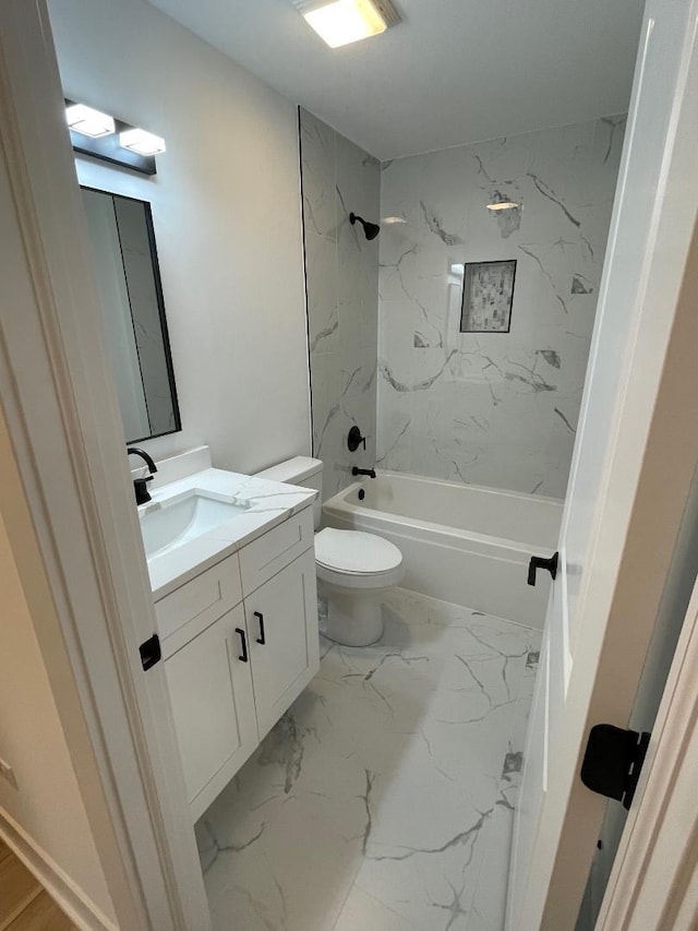 full bathroom with toilet, vanity, and tiled shower / bath combo