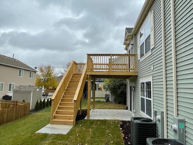 exterior space with a lawn and central AC