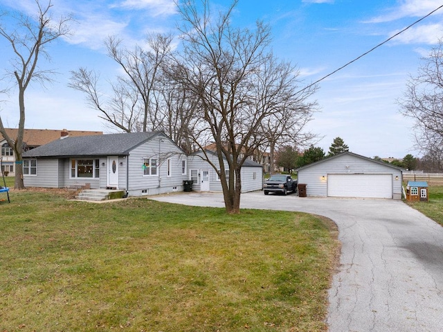 exterior space featuring a front yard, an outbuilding, and a garage