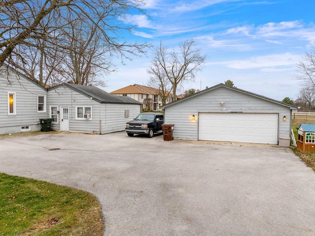 view of side of home featuring a garage