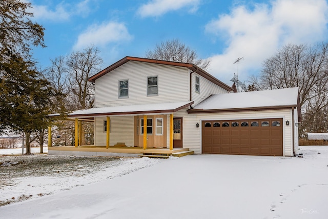 view of front of home with a garage and covered porch