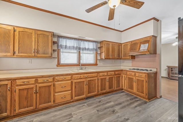 kitchen featuring brown cabinetry, white gas stovetop, open shelves, and light countertops