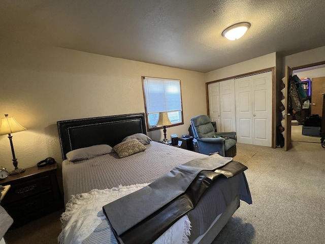 bedroom featuring a closet, carpet floors, and a textured ceiling