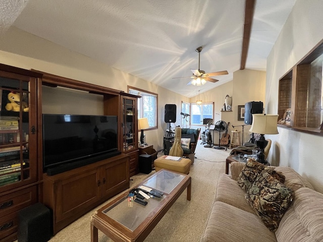 carpeted living room featuring a textured ceiling, ceiling fan, and lofted ceiling