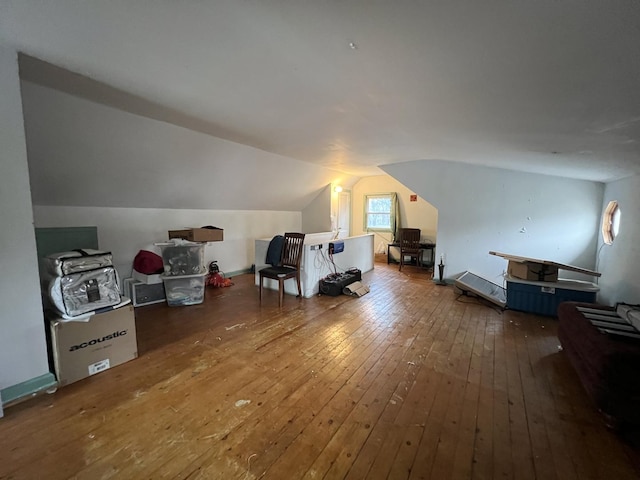 bonus room featuring wood-type flooring and lofted ceiling