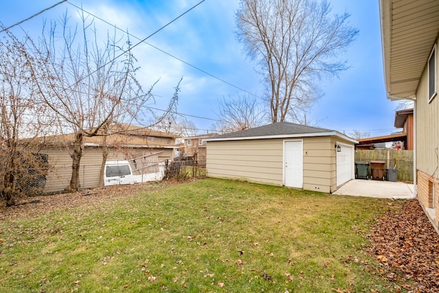 view of yard with an outbuilding and a garage