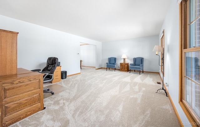 home office with carpet floors and baseboards