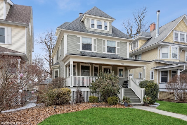 view of front facade featuring a porch and a front lawn