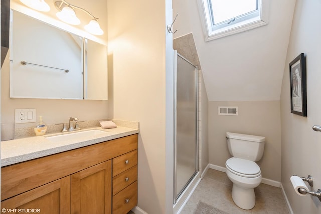 bathroom with tile patterned flooring, a shower with shower door, toilet, vanity, and lofted ceiling with skylight