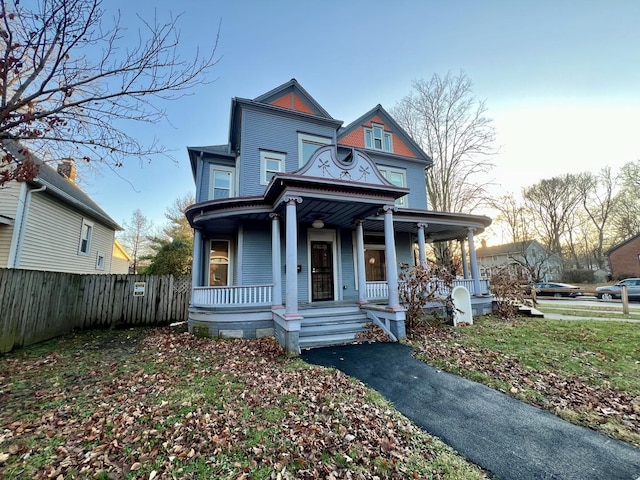 victorian-style house featuring covered porch