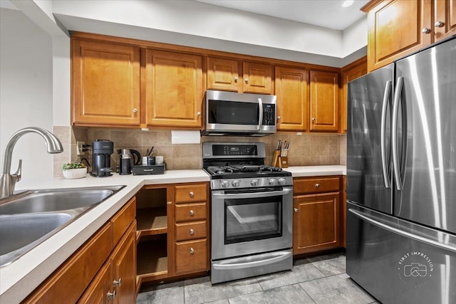 kitchen with backsplash, sink, and stainless steel appliances