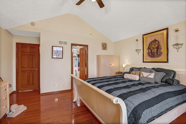 bedroom featuring ceiling fan, dark wood-type flooring, and vaulted ceiling