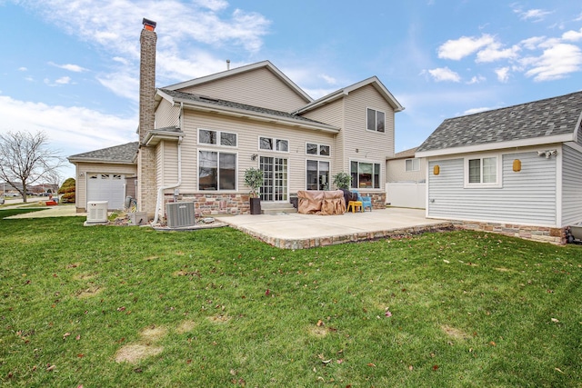 back of property featuring a patio, central air condition unit, and a lawn