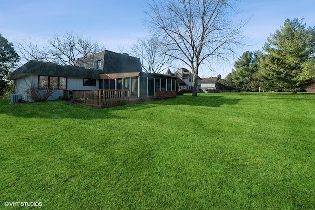 view of yard with cooling unit and a sunroom