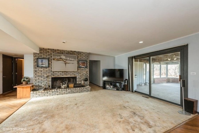 unfurnished living room featuring a fireplace and hardwood / wood-style floors