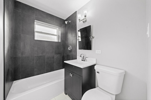 full bathroom featuring tile patterned flooring, vanity, tiled shower / bath combo, and toilet