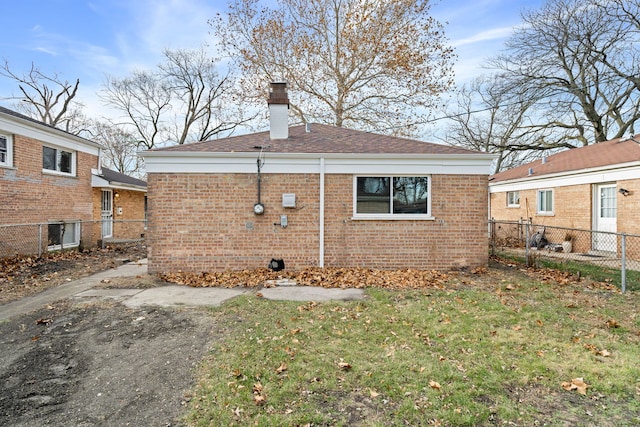 view of property exterior with a lawn