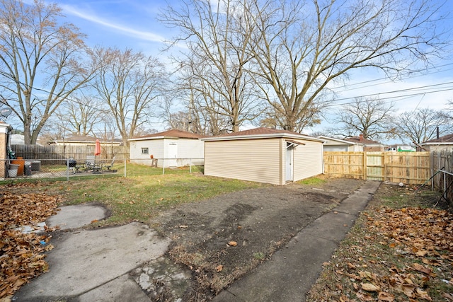14609 Dante Ave, Dolton, IL 60419 - fenced backyard featuring a storage unit