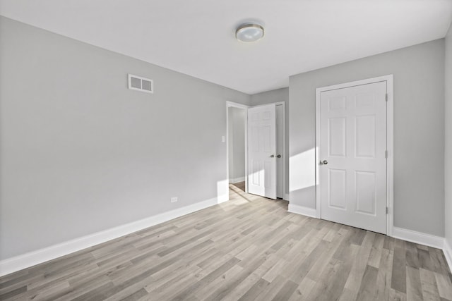 spare room featuring hardwood / wood-style floors