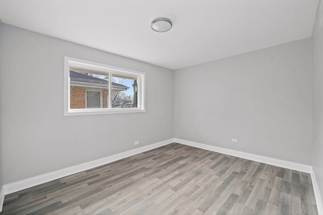 spare room with light wood-type flooring