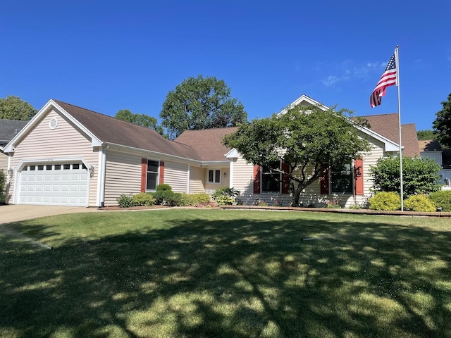 view of front of home featuring a garage, a front yard, and concrete driveway