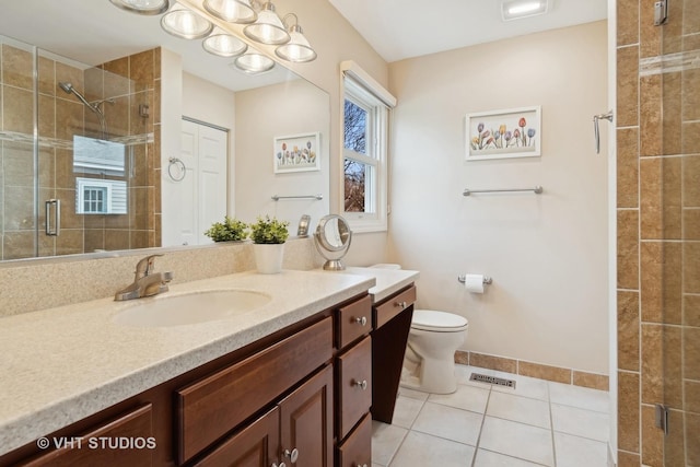 bathroom featuring a stall shower, visible vents, vanity, and toilet