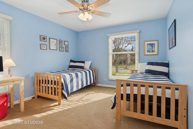 bedroom featuring carpet flooring, ceiling fan, and baseboards