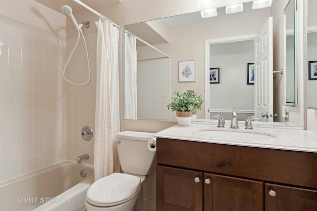 full bathroom with shower / tub combo, vanity, and toilet