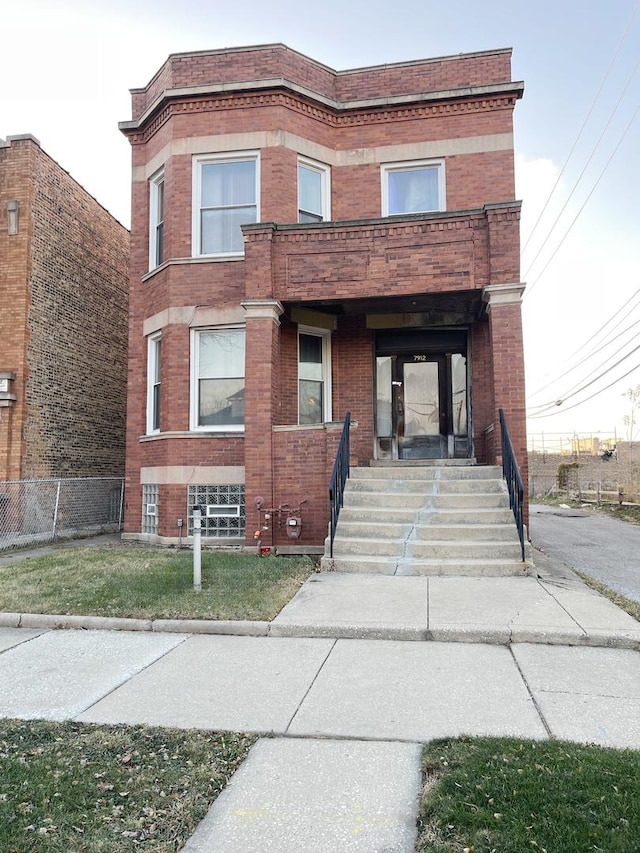 view of front facade with a balcony